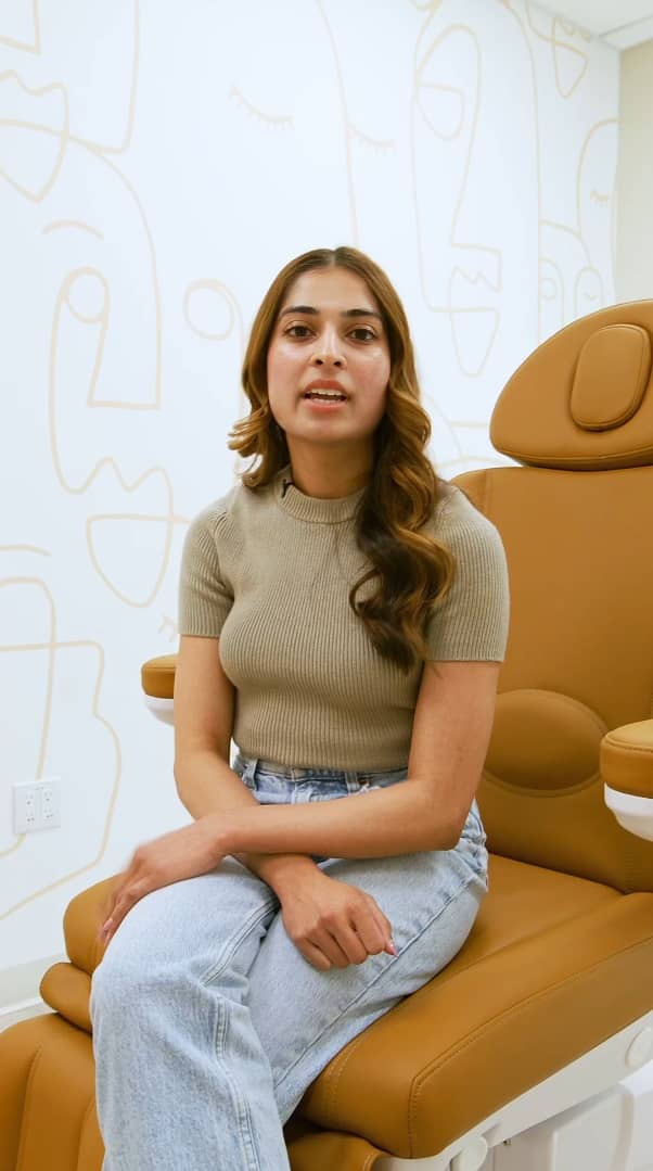 patient sitting in a chair ready to give a review